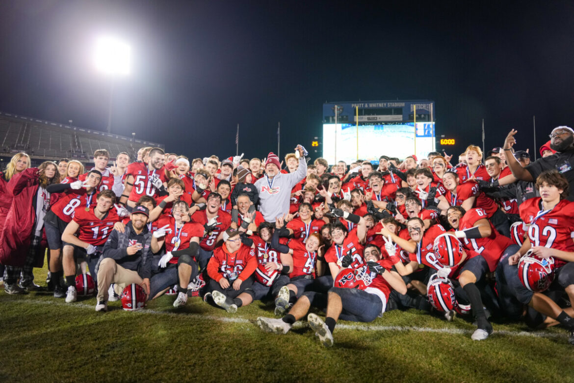 Rams rally defeat rival Darien and defend state title
