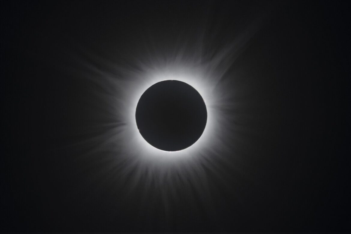 Hundreds of people gather together at Waveny Park to view the solar eclipse